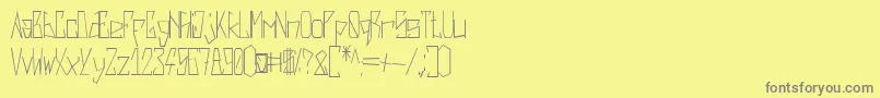 フォントHarsh   Regular – 黄色の背景に灰色の文字