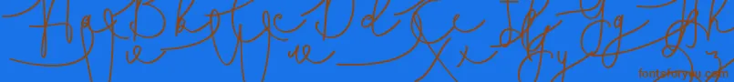 Hasnita Font – Brown Fonts on Blue Background