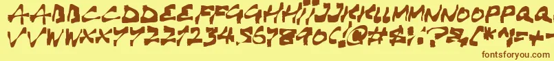 フォントHaunting – 茶色の文字が黄色の背景にあります。