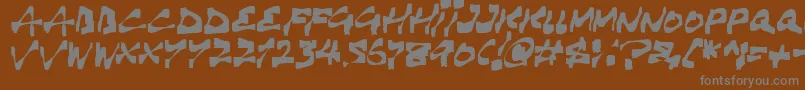 Haunting-fontti – harmaat kirjasimet ruskealla taustalla
