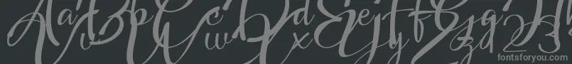 フォントHeadland Script – 黒い背景に灰色の文字
