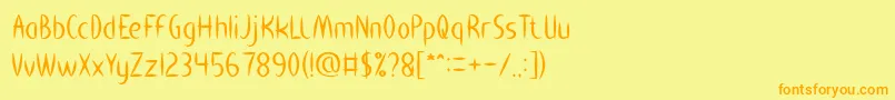 フォントHEART SHAPED – オレンジの文字が黄色の背景にあります。