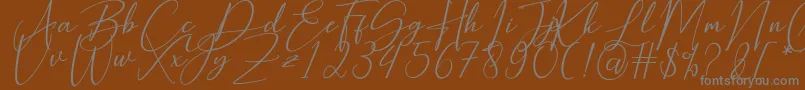 Hearth Stone-fontti – harmaat kirjasimet ruskealla taustalla