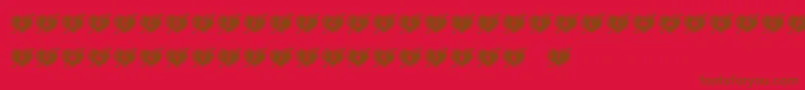 フォントHeartsandArrows – 赤い背景に茶色の文字