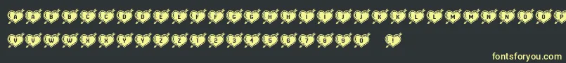 HeartsandArrows Font – Yellow Fonts on Black Background