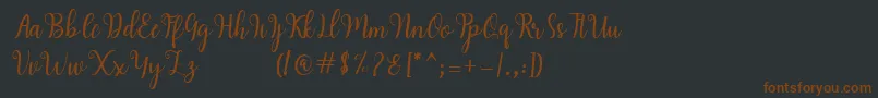 Hearty Script-fontti – ruskeat fontit mustalla taustalla