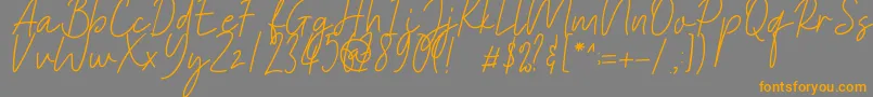 Heaternia Font – Orange Fonts on Gray Background