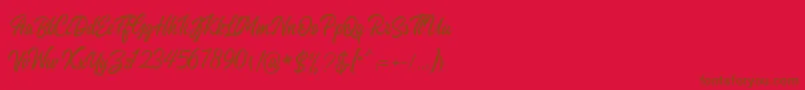 Fonte Heavenly Script – fontes marrons em um fundo vermelho