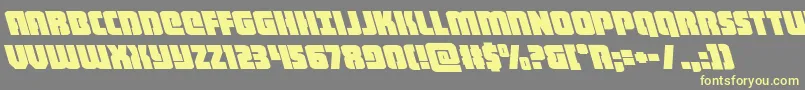 heavyfalconleft-fontti – keltaiset fontit harmaalla taustalla