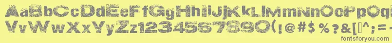 ActionOfTheTimeNew-Schriftart – Graue Schriften auf gelbem Hintergrund