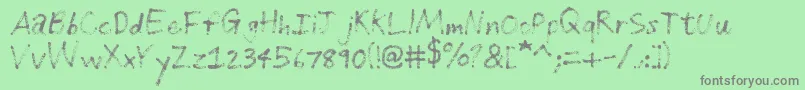 Fonte GrungeHandwriting – fontes cinzas em um fundo verde