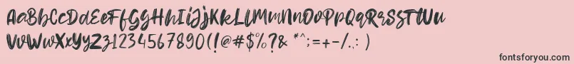 Fonte Hello Dear Demo – fontes pretas em um fundo rosa