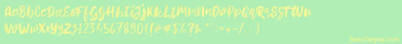フォントHello Dear Demo – 黄色の文字が緑の背景にあります