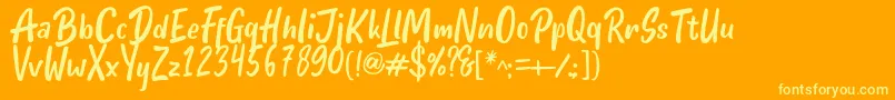 Hello Teman Regular by Andrian 7NTypes Font – Yellow Fonts on Orange Background