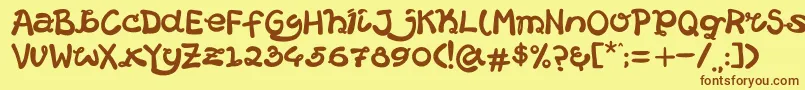 フォントHelloCatround – 茶色の文字が黄色の背景にあります。