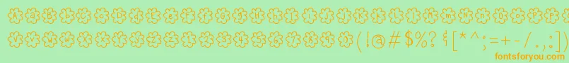 フォントHelloPopcorn – オレンジの文字が緑の背景にあります。