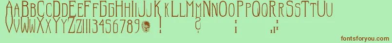 Hellraiser SC Font – Brown Fonts on Green Background