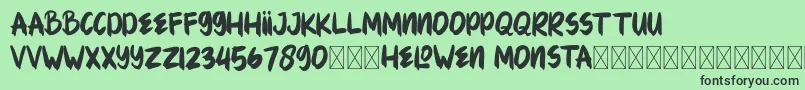 Czcionka HELOWENMONSTA – czarne czcionki na zielonym tle