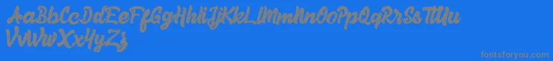 Więcej informacji o czcionce Herey Script Free Version Czcionka Herey Script Free Version – szare czcionki na niebieskim tle