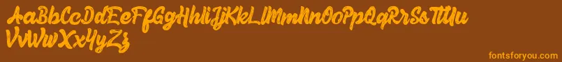 Herey Script Free Version-Schriftart – Orangefarbene Schriften auf braunem Hintergrund