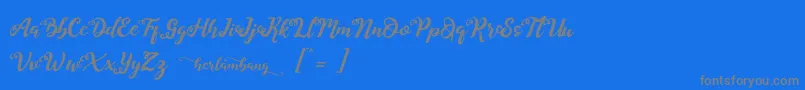 Herlambang-Schriftart – Graue Schriften auf blauem Hintergrund