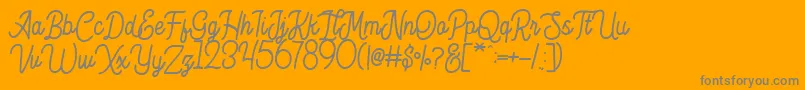 Fonte Hesland Demo – fontes cinzas em um fundo laranja