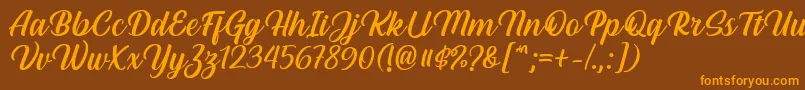 フォントHestina Font by Keithzo 7NTypes – オレンジ色の文字が茶色の背景にあります。