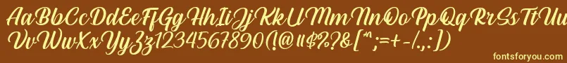 Hestina Font by Keithzo 7NTypes-fontti – keltaiset fontit ruskealla taustalla
