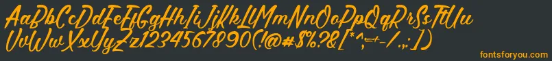 Hettas Font by 7NTypes Font – Orange Fonts on Black Background