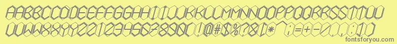 HEXCELLENT-fontti – harmaat kirjasimet keltaisella taustalla