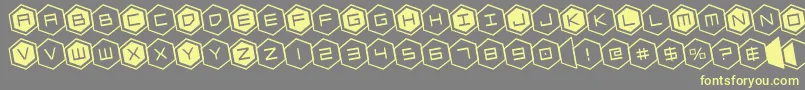 hexgonrotate Font – Yellow Fonts on Gray Background