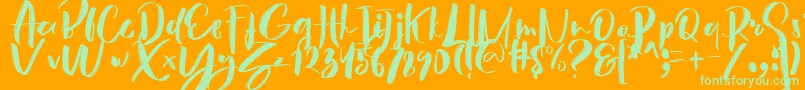 フォントHey Sunset Brush Font – オレンジの背景に緑のフォント