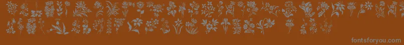 HFF Floral Stencil-fontti – harmaat kirjasimet ruskealla taustalla