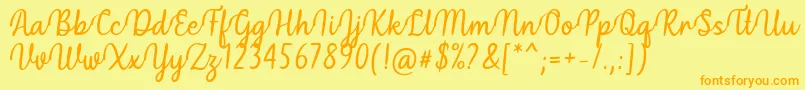 フォントHidea Font by Situjuh 7NTypes – オレンジの文字が黄色の背景にあります。