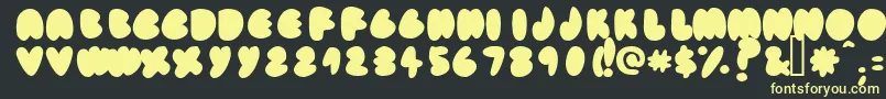 フォントFatassfi – 黒い背景に黄色の文字