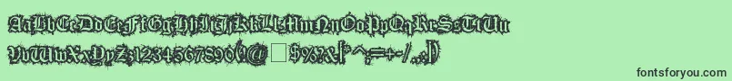 フォントFleshWound – 緑の背景に黒い文字
