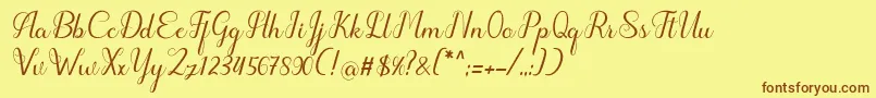 フォントhipnotis – 茶色の文字が黄色の背景にあります。