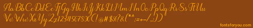 フォントhipnotis – オレンジ色の文字が茶色の背景にあります。