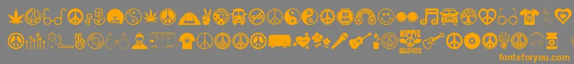 フォントHippie – オレンジの文字は灰色の背景にあります。