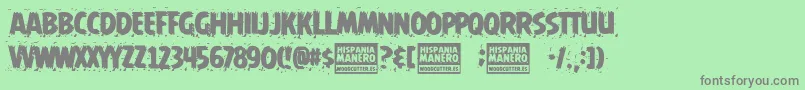 Hispania Manero-Schriftart – Graue Schriften auf grünem Hintergrund