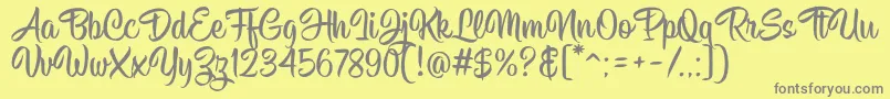 fuente Hisyam Script v1 – Fuentes Grises Sobre Fondo Amarillo