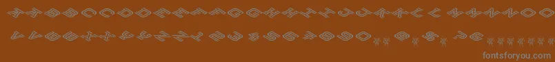 HokjesgeestCubeTopCW-fontti – harmaat kirjasimet ruskealla taustalla