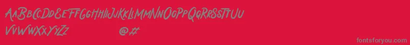 Holiday In Monday-Schriftart – Graue Schriften auf rotem Hintergrund