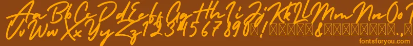 HolidayFree Font – Orange Fonts on Brown Background