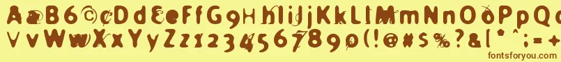 フォントHOLIER   – 茶色の文字が黄色の背景にあります。