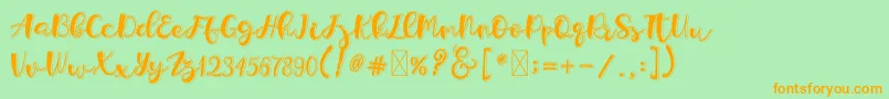 Holligrandina Font – Orange Fonts on Green Background
