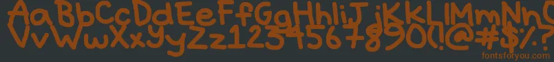 Hyperbole-fontti – ruskeat fontit mustalla taustalla