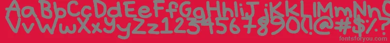 Hyperbole-fontti – harmaat kirjasimet punaisella taustalla