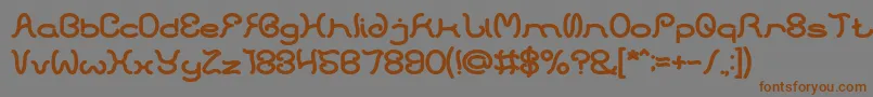 フォントHONESTLY BOLD – 茶色の文字が灰色の背景にあります。