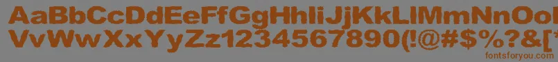 フォントRoughhewn – 茶色の文字が灰色の背景にあります。